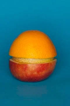 Uneven slices of different fruit stacked to comprise the shape of a piece of Stock Photos