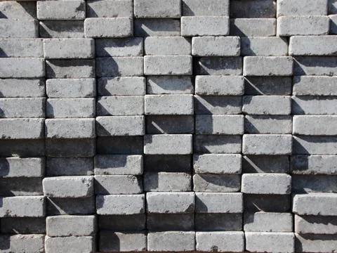 Uneven Stack of Grey Concrete Road Bricks Stock Photos