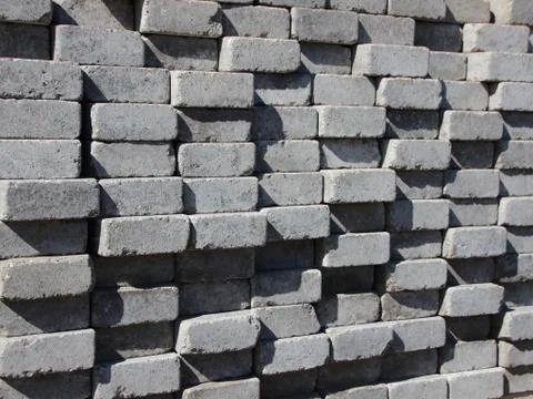 Uneven Stack of Grey Concrete Road Bricks Stock Photos