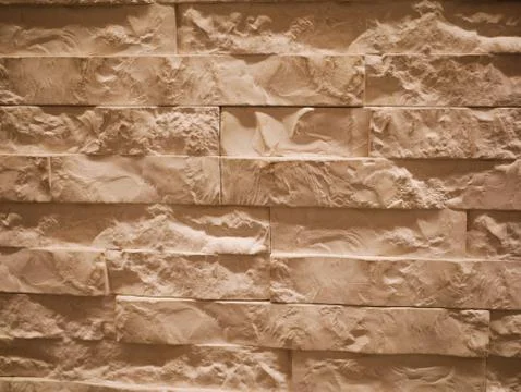 Uneven stone facade close-up. Torn stone texture. Stone wall. Stonewall abstr Foto stock