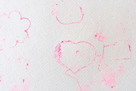 Uneven surface of paper texture with imprints of pink play clay in shape of Stock-Fotos