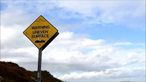 Uneven Surface Sign Rocky Mountain Walking Track Sea Coast Ben of Howth, Ireland Stock Footage 77839161
