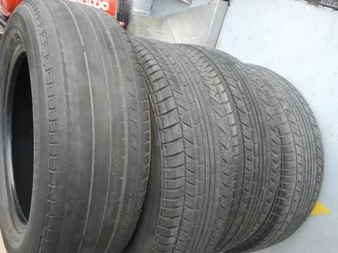 Uneven tires usage caused of unbalanced car’s wheels Stock Photos