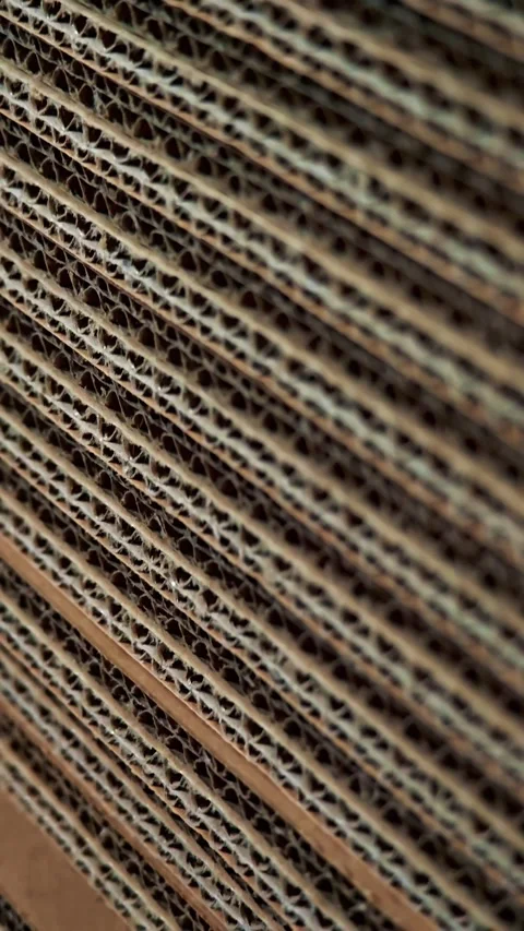 Uneven vertical stack of corrugated cardboard sheets close up Stock Footage 346188151