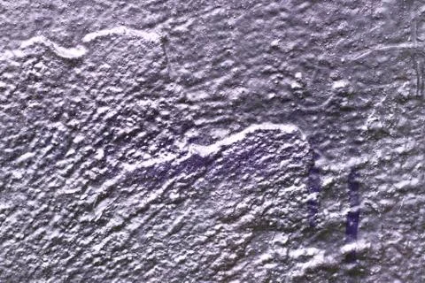 The uneven wall texture background was painted with silver spray Stock Photos
