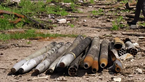 Unexploded ammunition of various calibers are stacked on the floor Stock Footage 217374426