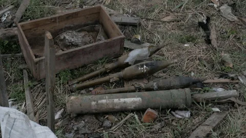 Unexploded grenades on the ground Video stock 195956254