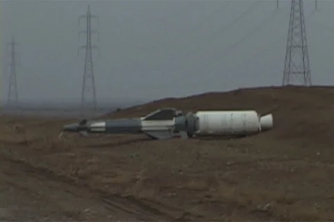 Unexploded missile lying on the side of the road to Kirkuk Stock Footage 86753412