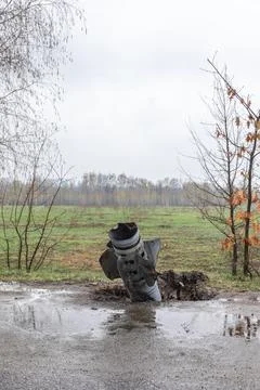 An unexploded rocket on the road Stock Photos