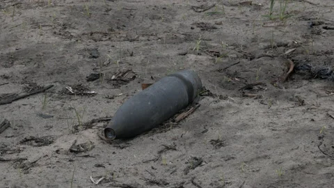 Unexploded shells on the ground Video stock 195791771