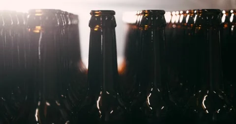 Unfilled Beer Bottles in Brewery, Camera Circling Around Stock Footage 335143146