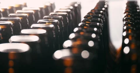 Unfilled Beer Bottles in Brewery, Camera Circling Around Stock Footage 335143179