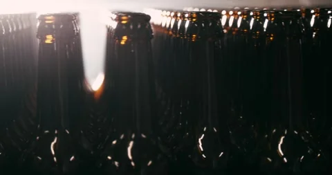 Unfilled Beer Bottles in Brewery, Camera Circling Around Stock Footage 335143199