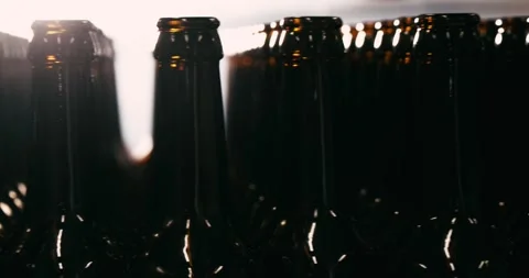 Unfilled Beer Bottles in Brewery, Camera Circling Around Stock Footage 335143251