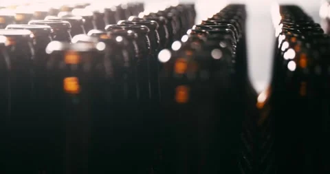 Unfilled Beer Bottles in Brewery, Camera Circling Around Stock Footage 335143369