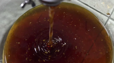The unfiltered honey flowing from machine Stock Footage 53429656