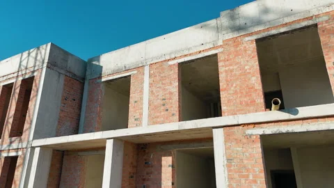 Unfinished Brick Building Under Construction, A partially constructed brick Stock Footage 300355063