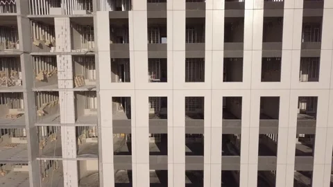 Unfinished building facade with large non-glazed windows Video stock 157665373