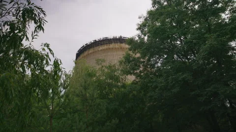 Unfinished Chernobyl Cooling Tower Surrounded by Forest Stock Footage 346403142