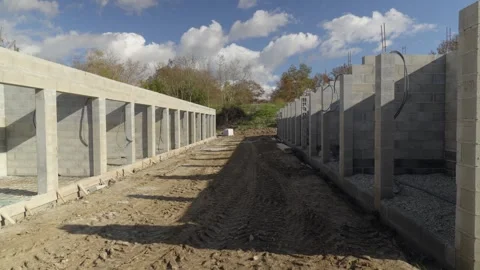 Unfinished Concrete Block Structures at Construction Site on Clear Daytime Stock Footage 335981082