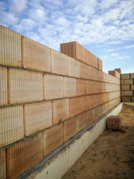 Unfinished construction ceramic block wall close up Foto stock