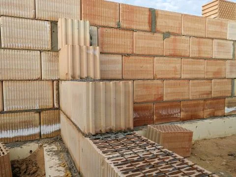 Unfinished construction ceramic block wall close up Stock Photos
