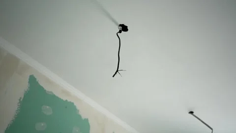 Unfinished electrical installations on concrete ceiling Stock Footage 285942293