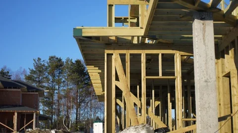 Unfinished frame house construction Stock Footage 105631722