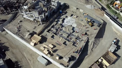 Unfinished hotel foundation development construction site plot aerial view Stock Footage 169858211