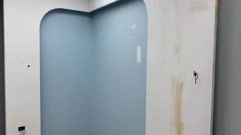 Unfinished interior painted blue wall. Architecture and home design concept Video stock 249730088