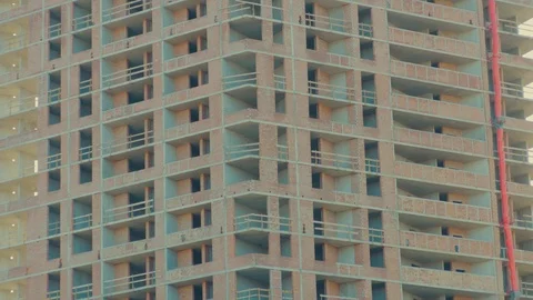 Unfinished large building with complete basic structure of concrete walls and Stock Footage 125253152
