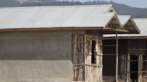Unfinished mud homes side by side close up shot. Stock Footage 97105401