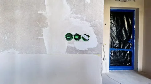 Unfinished Wall With Electrical Outlets During Interior Renovation 動画素材 346873665