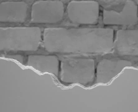 Unfinished wall with smooth plaster level surface and blurred brickwork Stock Photos