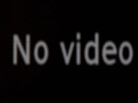 Unfocused close-up of No Video system message with irregular glitches  Stock Footage 71386270