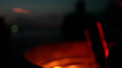 Unfocused fire pit at the beach, slider Stock Footage 24638590