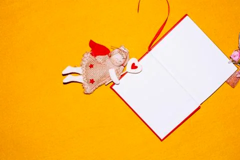 Unfolded notebooks with white sheets on a colored background in a cell Stock Photos