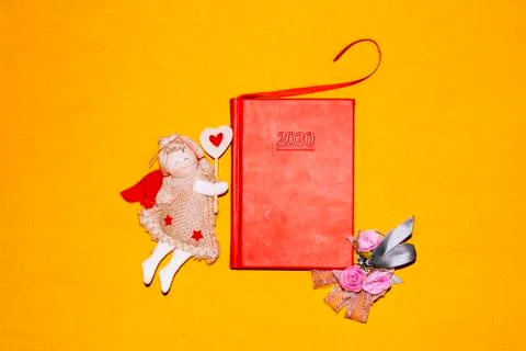 Unfolded notebooks with white sheets on a colored background in a cell Stock Photos