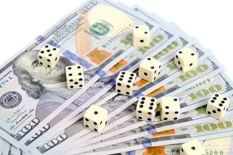 An unfolded stack of hundred-dollar bills and scattered cubes for naughty 스톡 사진