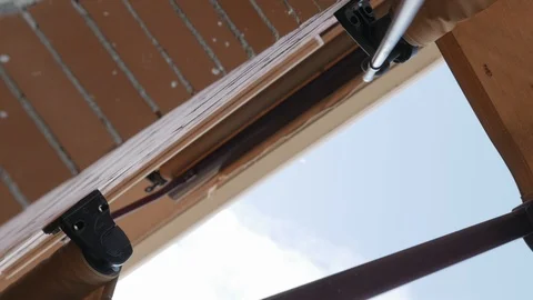 Unfolding the awning Stock Footage 108773609