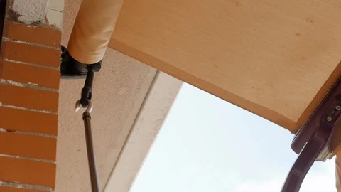 Unfolding the awning Stock Footage 108773623