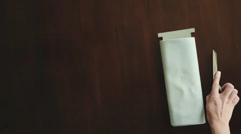 Unfolding Fabric with Scissors Stock Footage 68452915