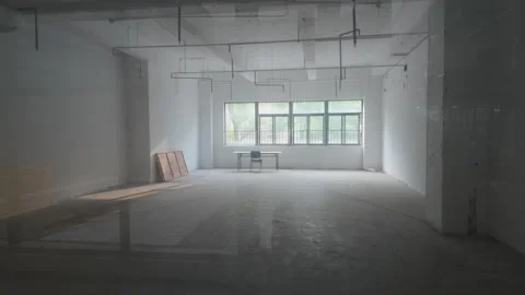Unfurnished Empty Commercial Interior With Table and Chair by Window, Wide Shot Stock Footage 333670271