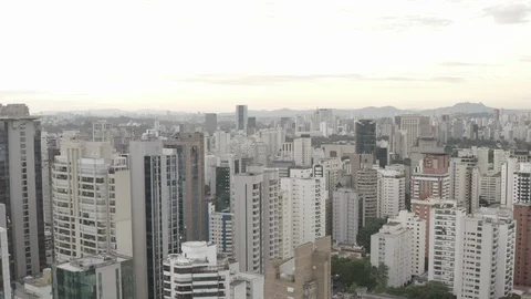 An ungraded low aerial view of buildings in a neighbourhood of Sao Paulo. Stock Footage 117570053