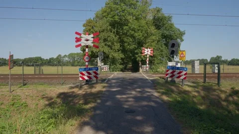 Unguarded Railway Crossing with Red Light Blinking in Heiloo Netherlands Stock Footage 341801488