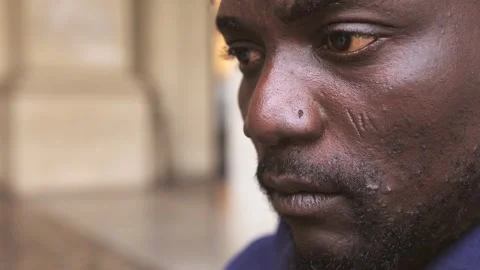 Unhappiness, thoughts -focus on sad face of young migrant opening his eyes Stock Footage 240325568