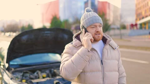 An Unhappy Accident A Driver Stranded with a Stock Footage 234137426