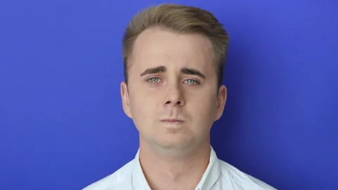 Unhappy depressed dramatic guy in white shirt crying, experiencing defeat from Stock Footage 219542961