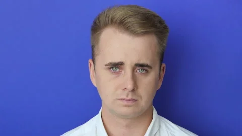 Unhappy depressed dramatic guy in white shirt crying, experiencing defeat from Stock Footage 220983901