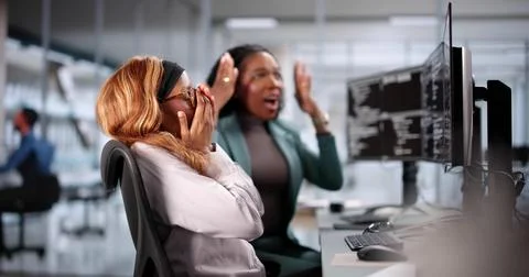 Unhappy developer stressed coding software on computer in office Foto stock